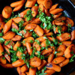 This recipe for Caramelized Carrots with Curry Spice features pungent curry powder, coarsely chopped cilantro leaves, with a touch of salt and pepper.
