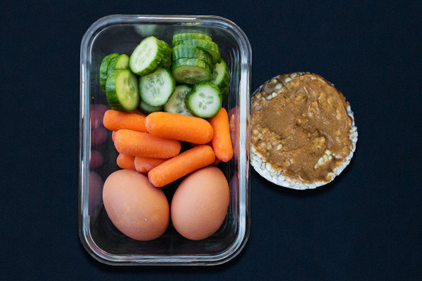Pre-workout meals for 80 Day Obsession, pre-workout nutrition, pre-workout snacks, carrots, cucumber slices, rice cakes, hard-boiled eggs