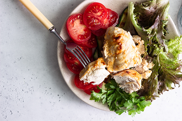 Chicken breast with salad, tomatoes