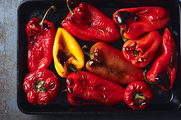 Roasted red and yellow peppers in a baking tray