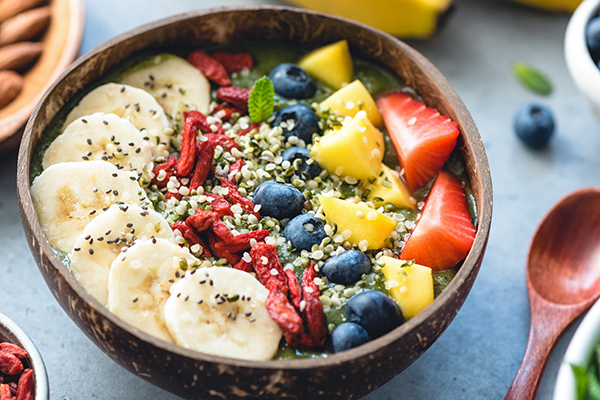 Smoothie bowl with fruits and healthy seeds