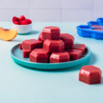 Raspberry Peach Energize Gummies on a plate