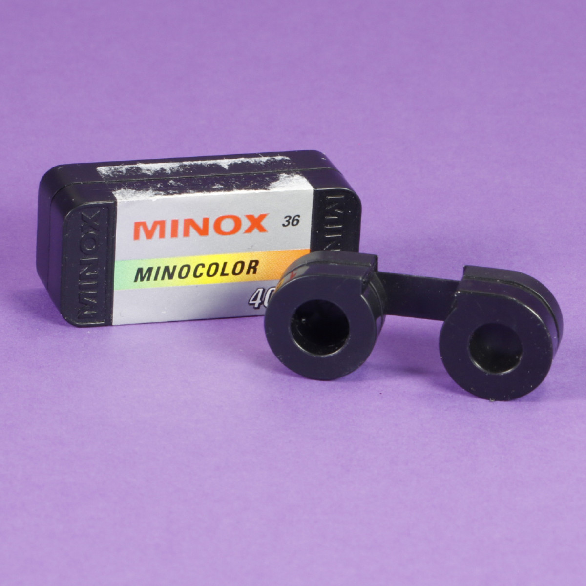 Empty Used Minox Film Cassette - Assorted Labels