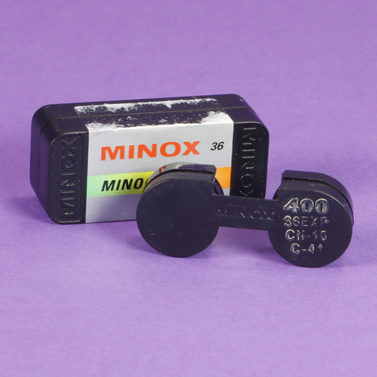 Empty Used Minox Film Cassette - Assorted Labels