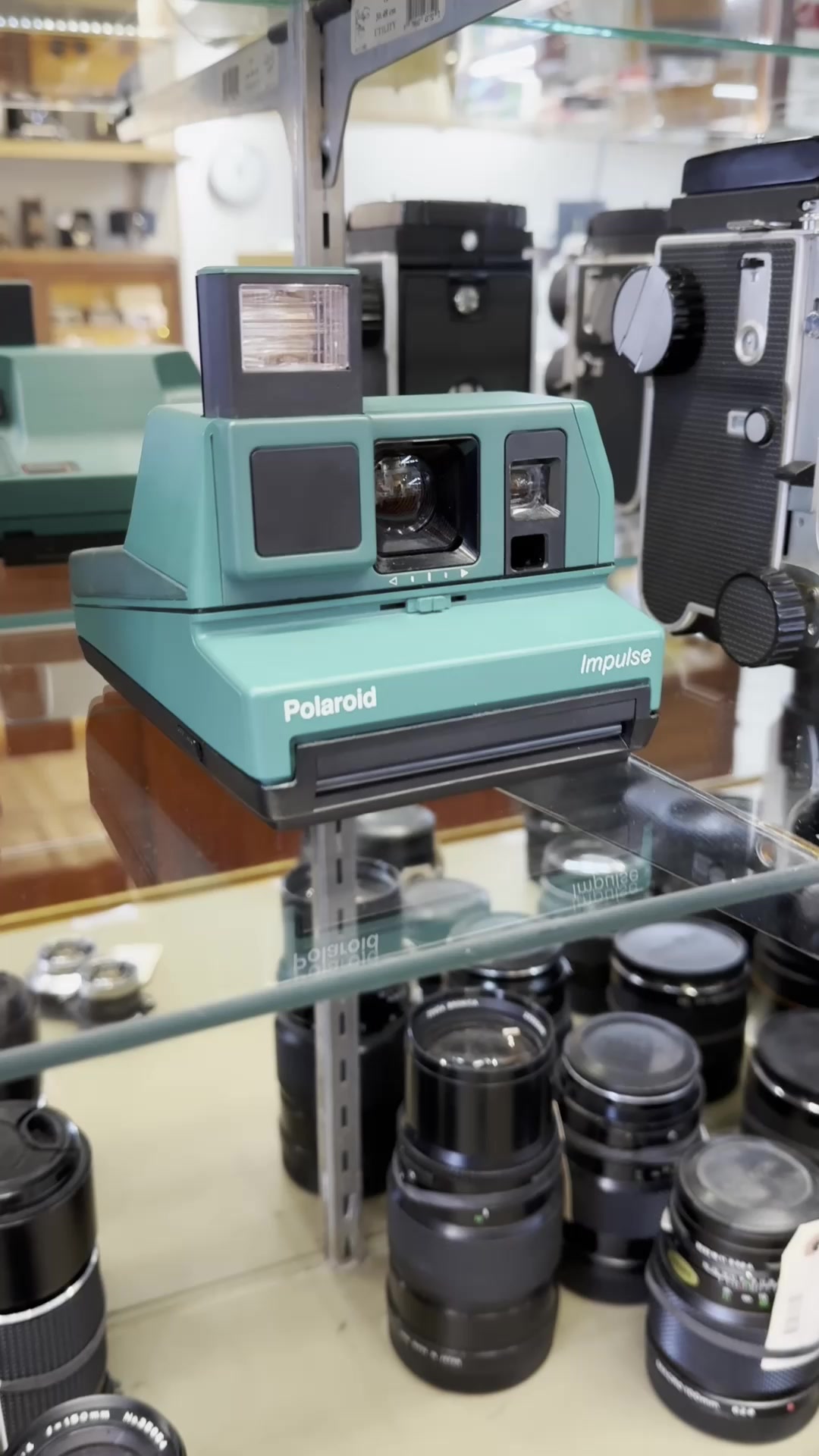 Shooting Polaroid 600 Round Frame in a Teal Polaroid Impulse