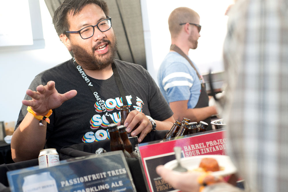 PAIRED brewer speaks with attendee