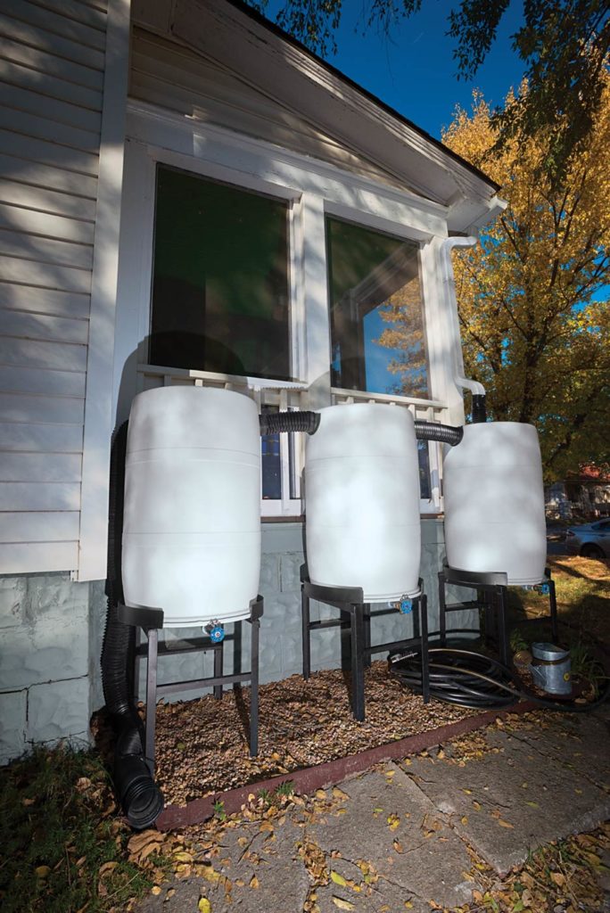 Many municipalities offer rebates to encourage installation of rain barrels like this bank of three 55-gallon tanks.