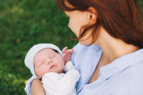 Adoptive mother holding her baby