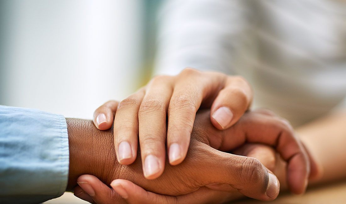 Parents holding hands