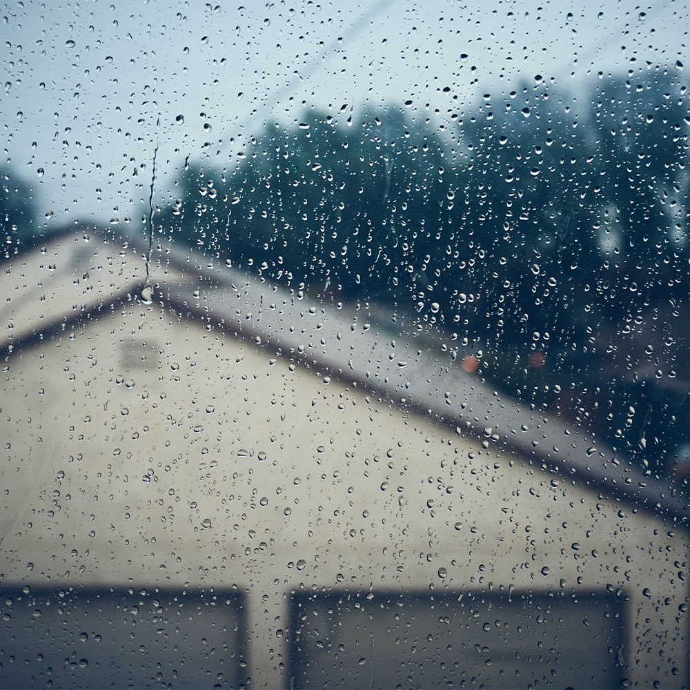 Heavy Rain in Open Metal Garage A