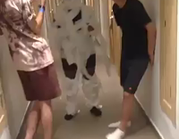 guy walking in hallway with toilet paper wrapped around body