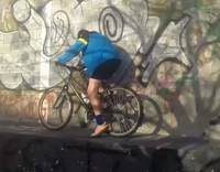 Blue Jacket Kid Tries To Ride Bike off Graffiti Wall Falls Over Handlebars