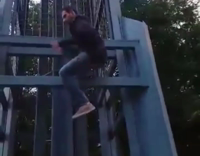 Plaid Shirt Guy Jumps Off Metal Statue Falls Down