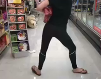 Girl in black tights at store dances and falls down 