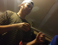 Guy in yellow striped shirt punches friend in blue shirt once 