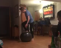 guy blue shirt on top of ball falls down