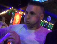 NSFW Black glasses guy selfie with white shirt guy gags on jello syringe shot