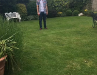 MUSIC guy orange shirt  tosses beer with shovel
