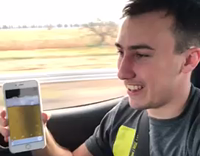 MUSIC guy pretends to drink a beer on his phone