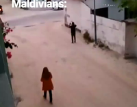 sky turns orange maldivians man in street