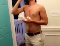 Shirtless guy chugs spaghetti sauce 