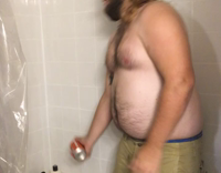 Fat guy in tub with green shorts cant smash red beer can
