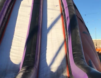 Girl Screams While Going Down Inflatable Slide and Hits Head
