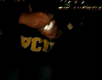 Girl in black sweatshirt opens and drinks beer 