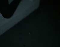 music guy in black laying down on cement steps