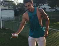 guy blue shirt hits beer can on head and spills it 