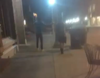 blue shirt kicking trash can and falling