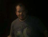 NSFW Big dude in grey green x shirt smashes beer on forehead and shotguns it