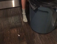 nsfw guy grey hoodie throwing up in trash can