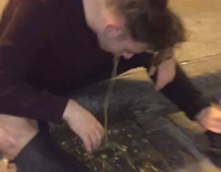 NSFW guy in purple shirt throwing up