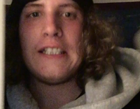 nsfw guy in blue throwing up in toilet