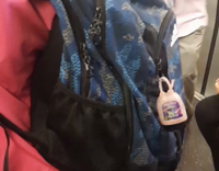 man in pink button up dancing on subway