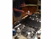 Music Guy in kitchen flips beer in skillet and then drinks it 