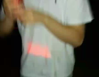 MUSIC Guy white shirt grey pants smashes red beer can on head and drinks it