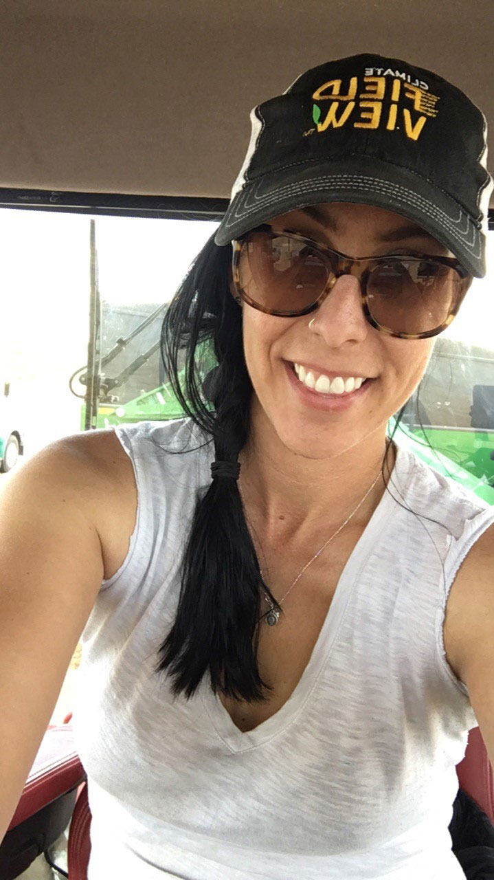 Kim Keller while farming in the cab of her tractor.