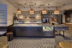 Preview of Anar - Image 0: Chair, Furniture, Blackboard, Luggage, Suitcase, Diner, Food, Meal, Restaurant, Couch, tile floor, steel counter, display.