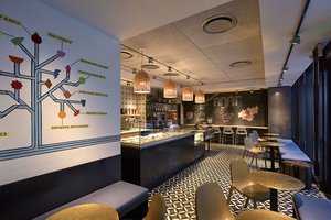 Preview of Anar - Image 1: Chair, Furniture, Dining Table, Table, Restaurant, Cafe, Indoors, Interior Design, tile floor, display counter, polysorb ceiling.