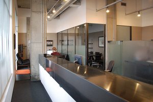 Preview of Attorneys Office - Image 2: Furniture, Reception, Reception Desk, Table, Conference Room, Indoors, Meeting Room, Room, interior glass, structure concrete, steel counter, exposed duct.