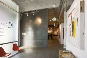Preview of Grand Image - Image 0: Chair, Furniture, art, concrete floor, exposed duct, meeting space, gallery, rolling door.