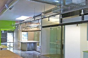 Preview of Ip Resources - Image 4: Wood, Glass, Exposed Duct, Exposed Structure, Track Lighting, Steel, Concrete, Window, Entry, concrete floor, glass interior, desk.