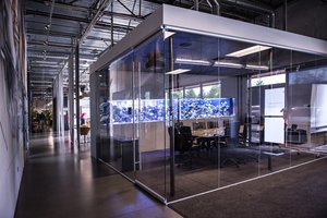 Preview of Light Manufacturing - Image 9: Airport Terminal, Dining Table, Indoors, Steel, Concrete, Carpet, Meeting Room, Conference Room, Glass, Structure Steel, Exposed Structure, Exposed Duct, Graffiti, Chainmail, Curtain, Fish Tank.