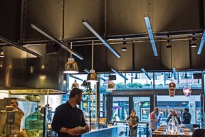 Preview of Mamnoon Restaurant - Image 1: Human, Steel, Exposed Structure, Wood, Concrete, Glass, Window, Glass Door, Sliding Door, Table, Dining, Restaurant, Kitchen, Stainless Steel.