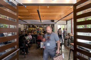 Preview of Mamnoon Street - Image 3: People, Steel , Wood, Concrete, Glass, Entry, Door, Bar, Dining Table.