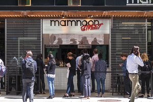 Preview of Mamnoon Street - Image 8: Window, Steel, Steel Grate, Wood, Concrete, Street, Storefront, Dining Table, Restaurant.