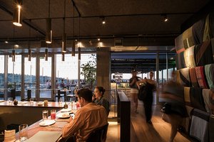 Preview of Mbar - Image 11: Human, Person, Restaurant, Glass, Window, Concrete, Steel, Bar, Dining Table, Wood, Rooftop, Outdoor, Structure Steel, Pergola.