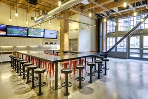 Preview of Payscale - Image 2: historic, Bar Stool, Furniture, Dining Table, Table, Structure wood, Concrete floor, Indoor, Exposed duct, Lighting, Wood ceiling.